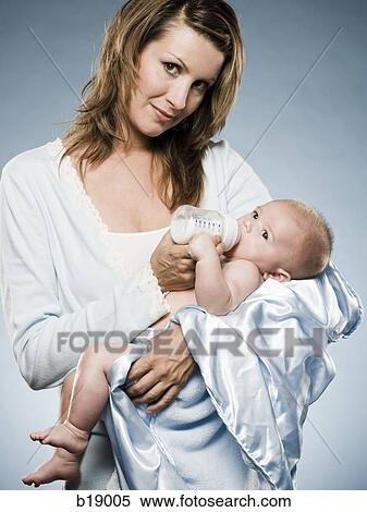 Stock Photography - Woman and baby.. Fotosearch