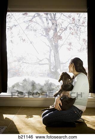 woman and dog in living room View Large Photo Image Stock Photograph - woman and dog in living room. Fotosearch