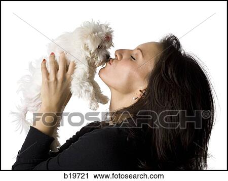 Stock Image - woman and puppy. Fotosearch