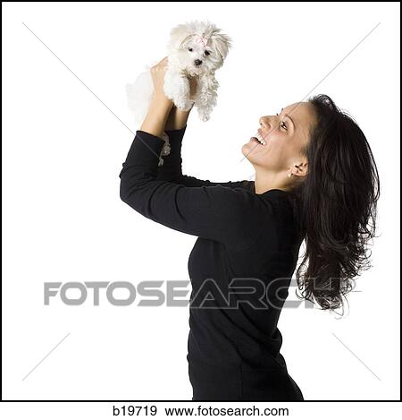Stock Photo - woman and puppy. Fotosearch