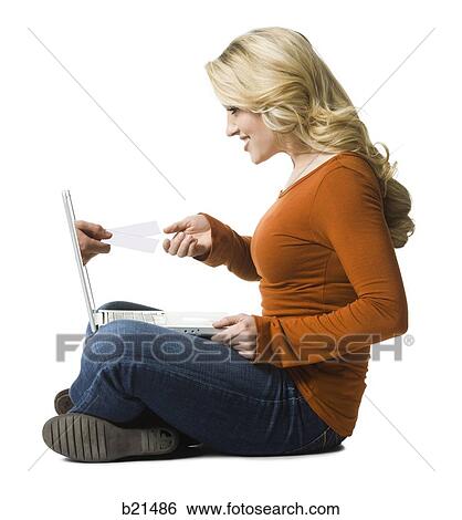 woman buying concert tickets on a laptop View Large Photo Image Stock Photograph - woman buying concert tickets on a laptop. Fotosearch
