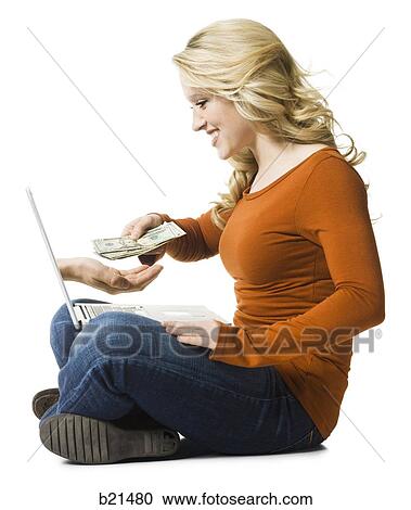 Stock Image - woman buying online. Fotosearch