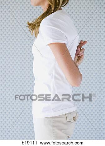 Woman crossing fingers behind her back. View Large Photo Image Stock Image - Woman crossing fingers behind her back.. Fotosearch