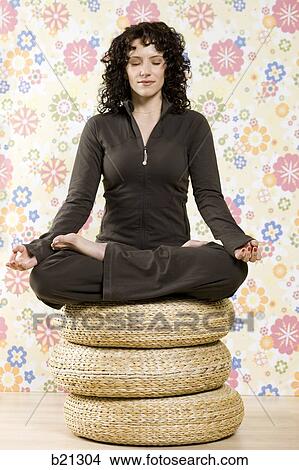 Picture - woman doing yoga. Fotosearch