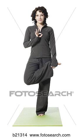 Picture - woman doing yoga. Fotosearch
