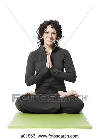 Stock Image - woman doing yoga. Fotosearch