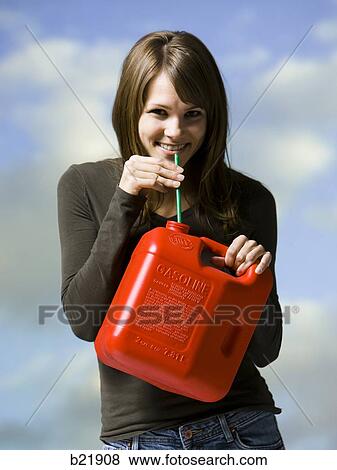 Stock Photo - woman drinking gasoline. Fotosearch
