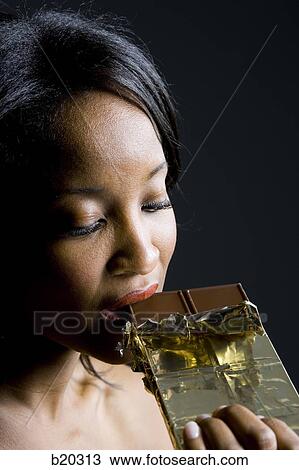 woman eating chocolate View Large Photo Image Stock Image - woman eating chocolate. Fotosearch