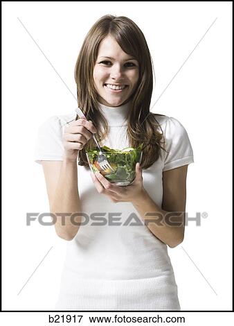 woman eating healthily View Large Photo Image Stock Photo - woman eating healthily. Fotosearch