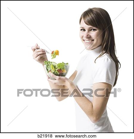 woman eating healthily View Large Photo Image Stock Photo - woman eating healthily. Fotosearch