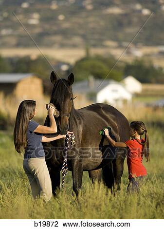 "woman, girl, and a horse" View Large Photo Image Stock Image - "woman, girl, and a horse". Fotosearch