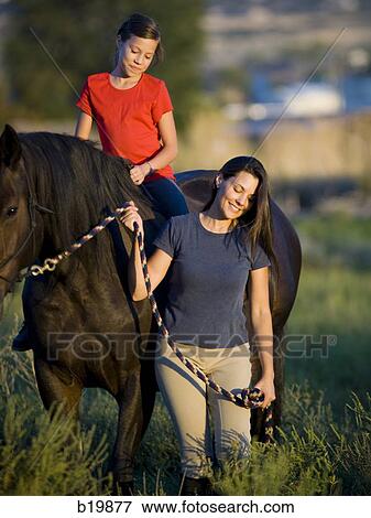 "woman, girl, and a horse" View Large Photo Image Stock Photo - "woman, girl, and a horse". Fotosearch