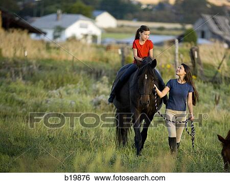 "woman, girl, and a horse" View Large Photo Image Stock Photograph - "woman, girl, and a horse". Fotosearch