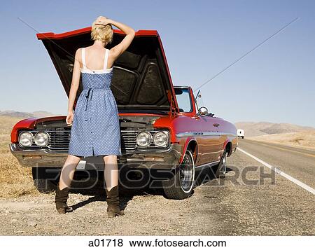 Stock Photo - Woman having car trouble.. Fotosearch