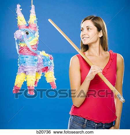 woman hitting a pinata View Large Photo Image Stock Photograph - woman hitting a pinata. Fotosearch