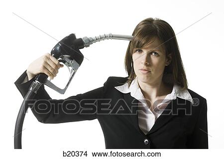 woman holding a gas pump to her head View Large Photo Image Picture - woman holding a gas pump to her head. Fotosearch