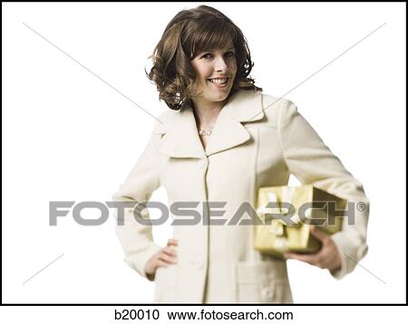 woman holding a gift View Large Photo Image Stock Image - woman holding a gift. Fotosearch