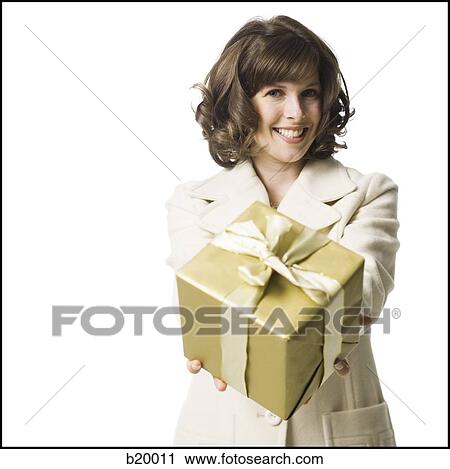woman holding a gift View Large Photo Image Stock Image - woman holding a gift. Fotosearch