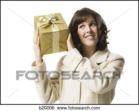 woman holding a gift View Large Photo Image Stock Photograph - woman holding a gift. Fotosearch