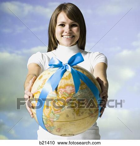 woman holding a globe View Large Photo Image Stock Image - woman holding a globe. Fotosearch