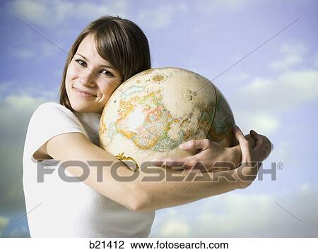 woman holding a globe View Large Photo Image Stock Image - woman holding a globe. Fotosearch