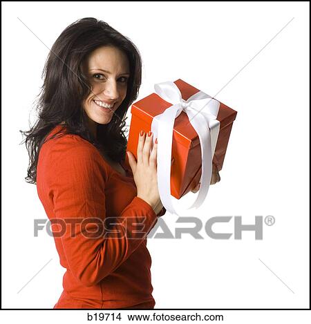 woman holding a present View Large Photo Image Picture - woman holding a present. Fotosearch