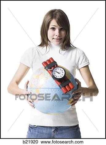 woman holding dynamite on the earth View Large Photo Image Stock Image - woman holding dynamite on the earth. Fotosearch