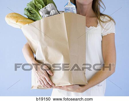 woman holding groceries. View Large Photo Image Stock Image - woman holding groceries.. Fotosearch