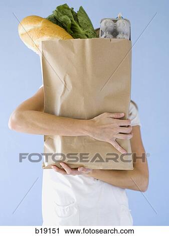 woman holding groceries. View Large Photo Image Stock Image - woman holding groceries.. Fotosearch