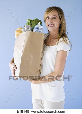 woman holding groceries. View Large Photo Image Stock Photo - woman holding groceries.. Fotosearch