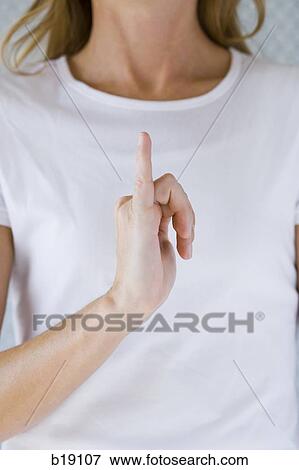 Woman holding hand up with outstretched small finger. View Large Photo Image Stock Photo - Woman holding hand up with outstretched small finger.. Fotosearch