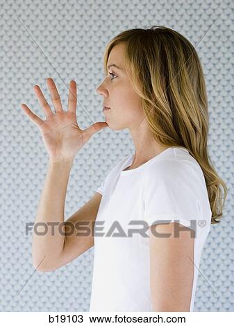 Woman holding open hand to chin. View Large Photo Image Stock Image - Woman holding open hand to chin.. Fotosearch