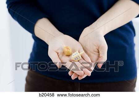 woman holding tow dradles View Large Photo Image Stock Photo - woman holding tow dradles. Fotosearch