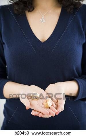 Stock Photo - woman holding tow dradles. Fotosearch
