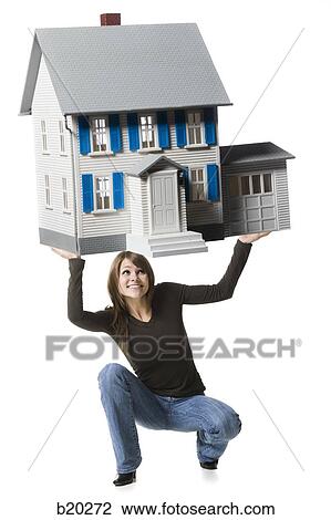 woman holding up a house View Large Photo Image Stock Image - woman holding up a house. Fotosearch