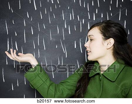 Stock Photo - woman in a chalkboard rainstorm. Fotosearch