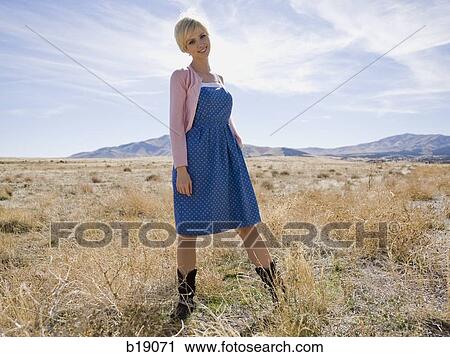woman in a pink sweater in the middle of nowhere. View Large Photo Image Stock Image - woman in a pink sweater in the middle of nowhere.. Fotosearch