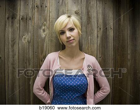 Stock Image - woman in a pink sweater.. Fotosearch