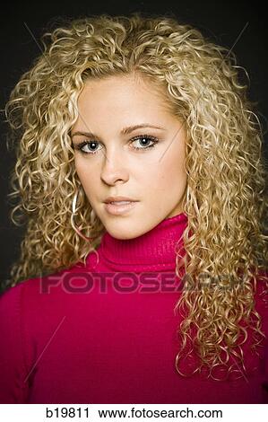 Stock Image - woman in a pink sweater. Fotosearch