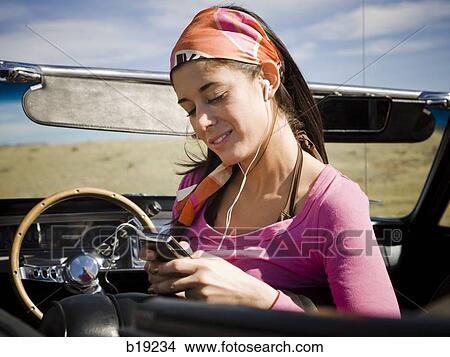 woman in a red convertible View Large Photo Image Picture - woman in a red convertible. Fotosearch
