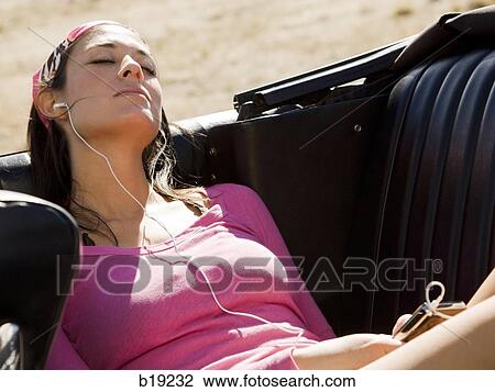 woman in a red convertible View Large Photo Image Stock Image - woman in a red convertible. Fotosearch