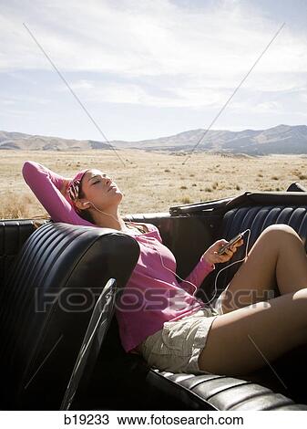 woman in a red convertible View Large Photo Image Stock Image - woman in a red convertible. Fotosearch