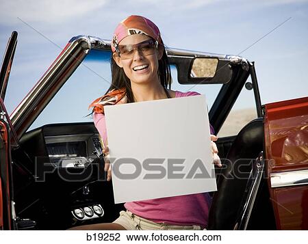 woman in a red convertible View Large Photo Image Stock Image - woman in a red convertible. Fotosearch