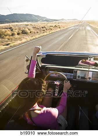 woman in a red convertible View Large Photo Image Stock Image - woman in a red convertible. Fotosearch