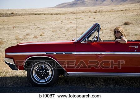 woman in a red convertible. View Large Photo Image Stock Photo - woman in a red convertible.. Fotosearch