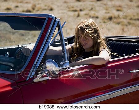 woman in a red convertible. View Large Photo Image Stock Photo - woman in a red convertible.. Fotosearch