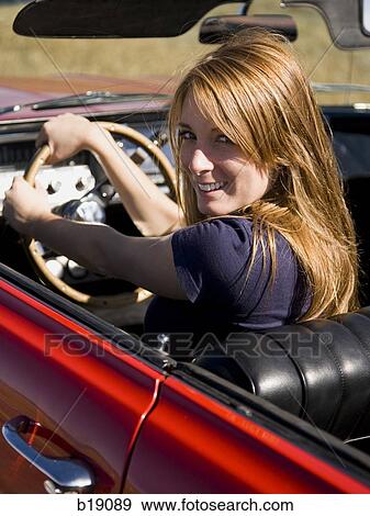 woman in a red convertible. View Large Photo Image Stock Photo - woman in a red convertible.. Fotosearch