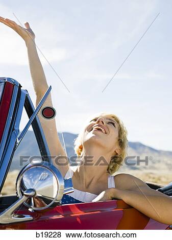 woman in a red convertible View Large Photo Image Stock Photo - woman in a red convertible. Fotosearch