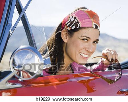 woman in a red convertible View Large Photo Image Stock Photo - woman in a red convertible. Fotosearch