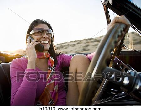 woman in a red convertible View Large Photo Image Stock Photo - woman in a red convertible. Fotosearch